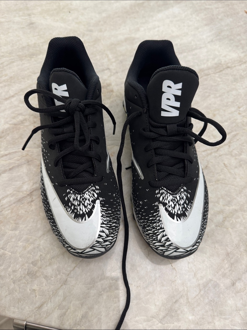 Nike Kids Black and White Graphic Swoosh cleats